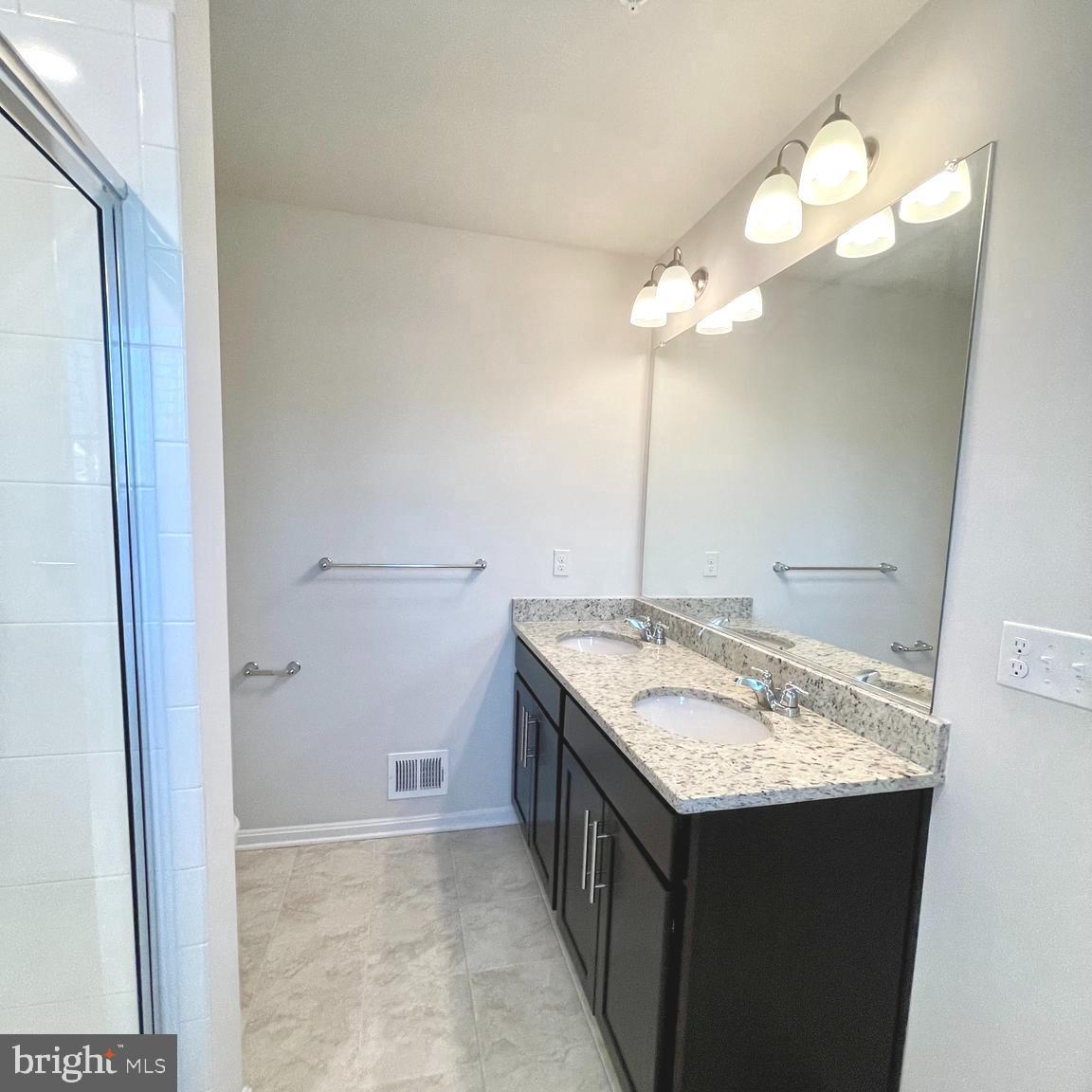 2709 Princess Victoria Way Bowie, MD 20721 - Photo 19 of 31 a bathroom with a granite countertop sink and a mirror