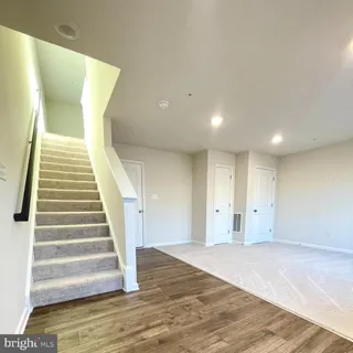 a view of an entryway with wooden floor