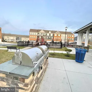 a view of a house with backyard and swimming pool