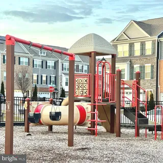 a living room with hard wood flooring and a table