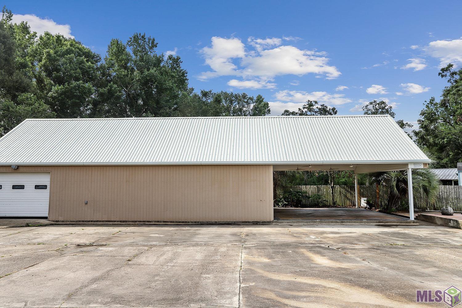 12051 Griffith Road Gonzales, LA 70737 - Photo 7 of 30 30 X 74 shop with roll up doors
