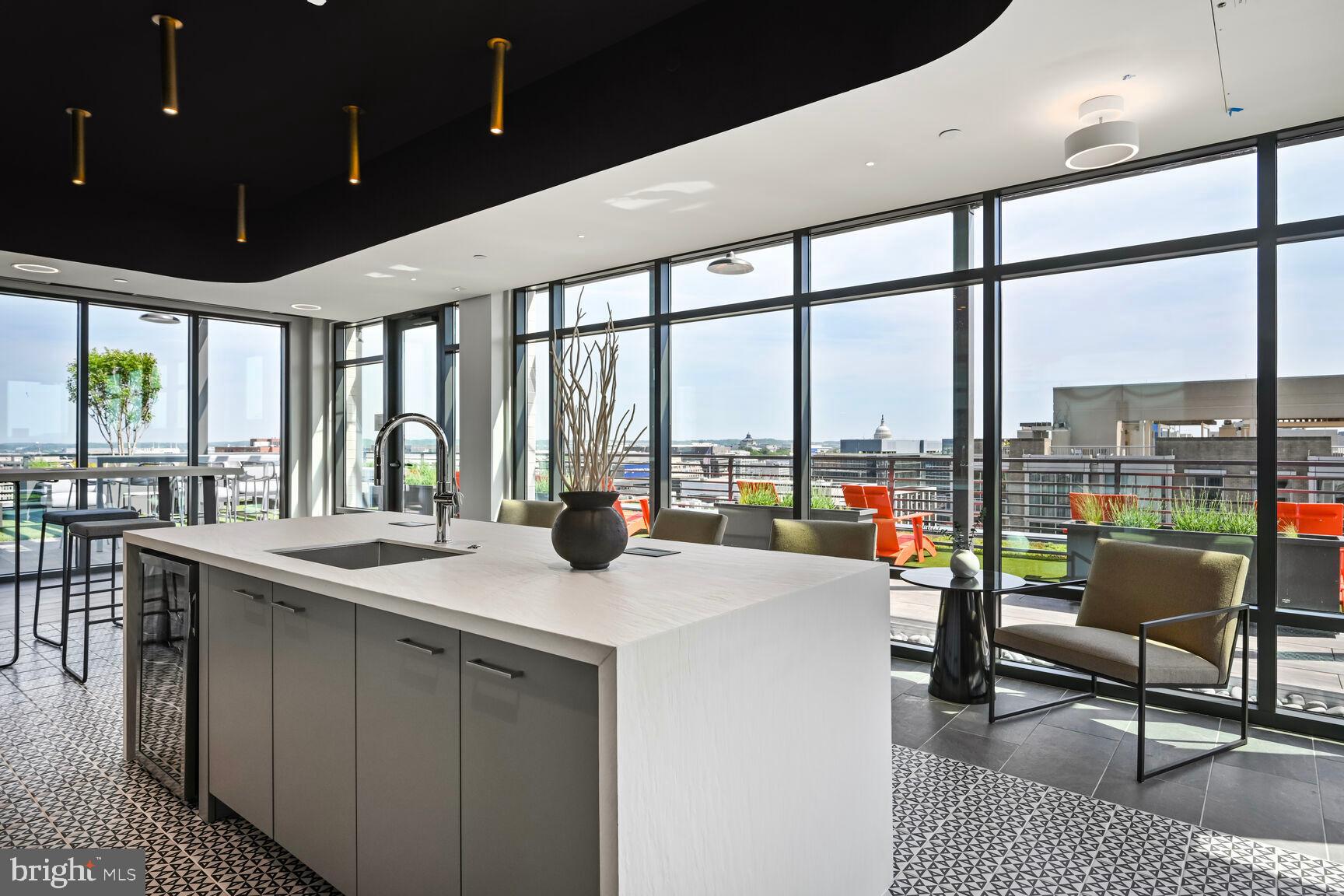 950 3rd Street Northwest, Unit PH1202 Washington, DC 20001 - Photo 17 of 45 a kitchen with a large window and dining table