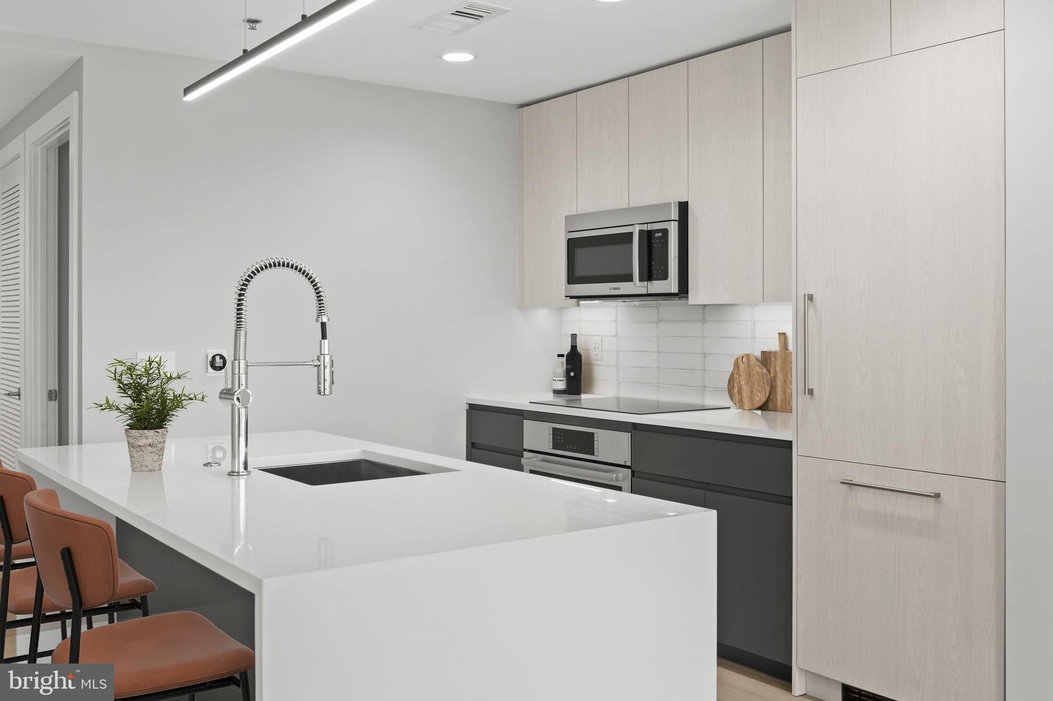 950 3rd Street Northwest, Unit PH1202 Washington, DC 20001 - Photo 22 of 45 a kitchen with a sink and a microwave