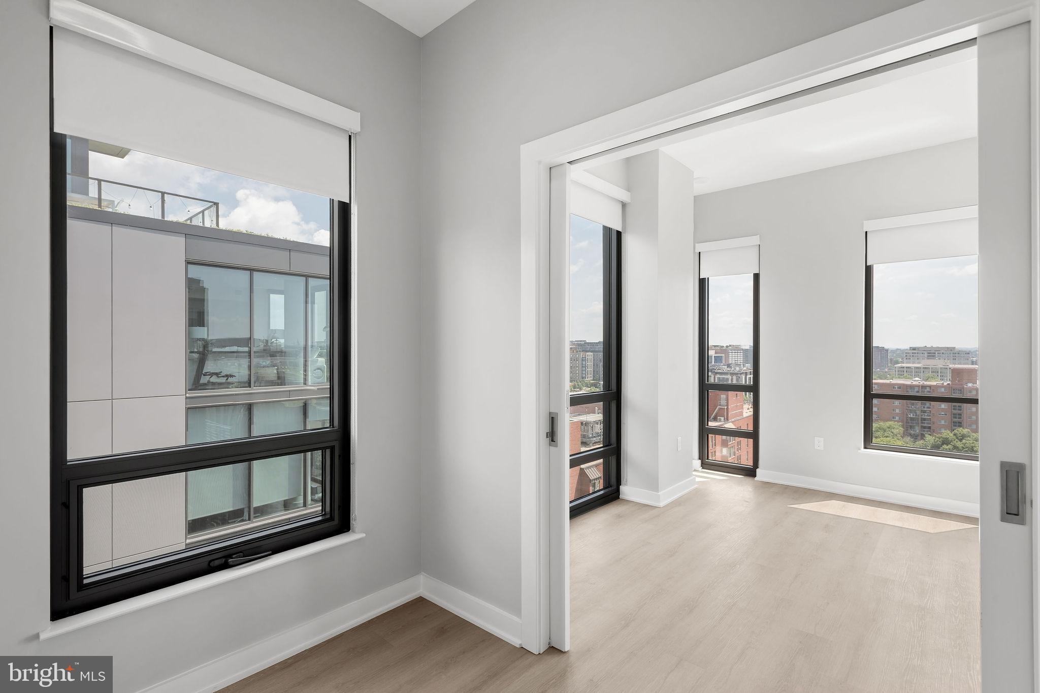 950 3rd Street Northwest, Unit PH1202 Washington, DC 20001 - Photo 33 of 45 an empty room with windows and closet