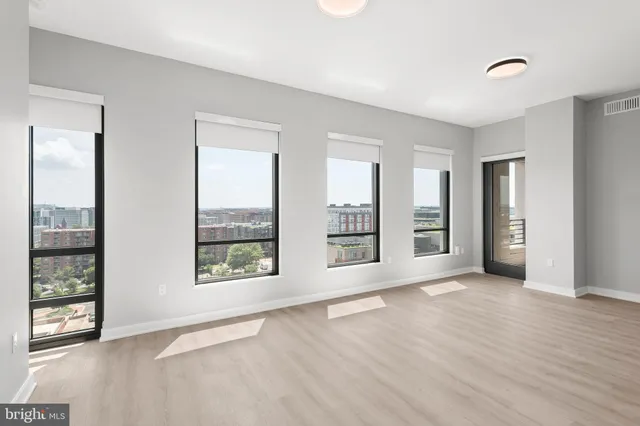 a view of a bathroom with a toilet and a window