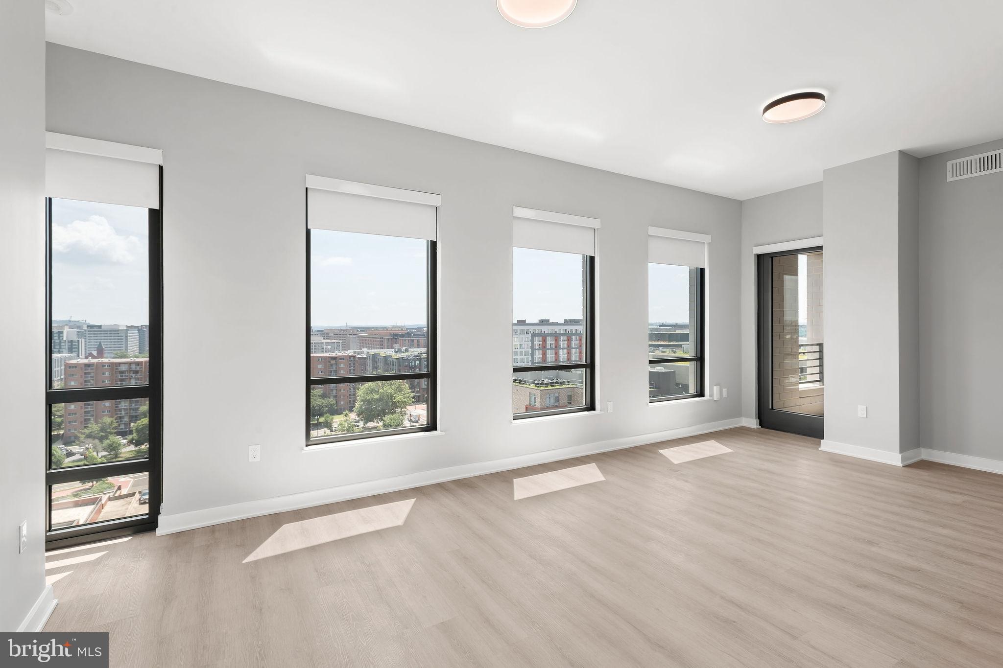 950 3rd Street Northwest, Unit PH1202 Washington, DC 20001 - Photo 35 of 45 an empty room with windows and closet