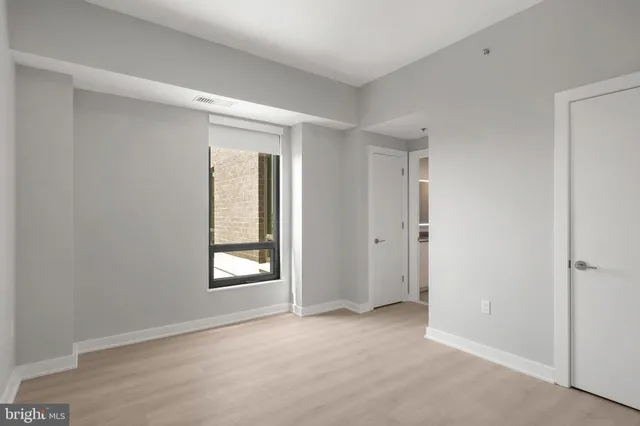 a bathroom with a double vanity sink toilet and shower