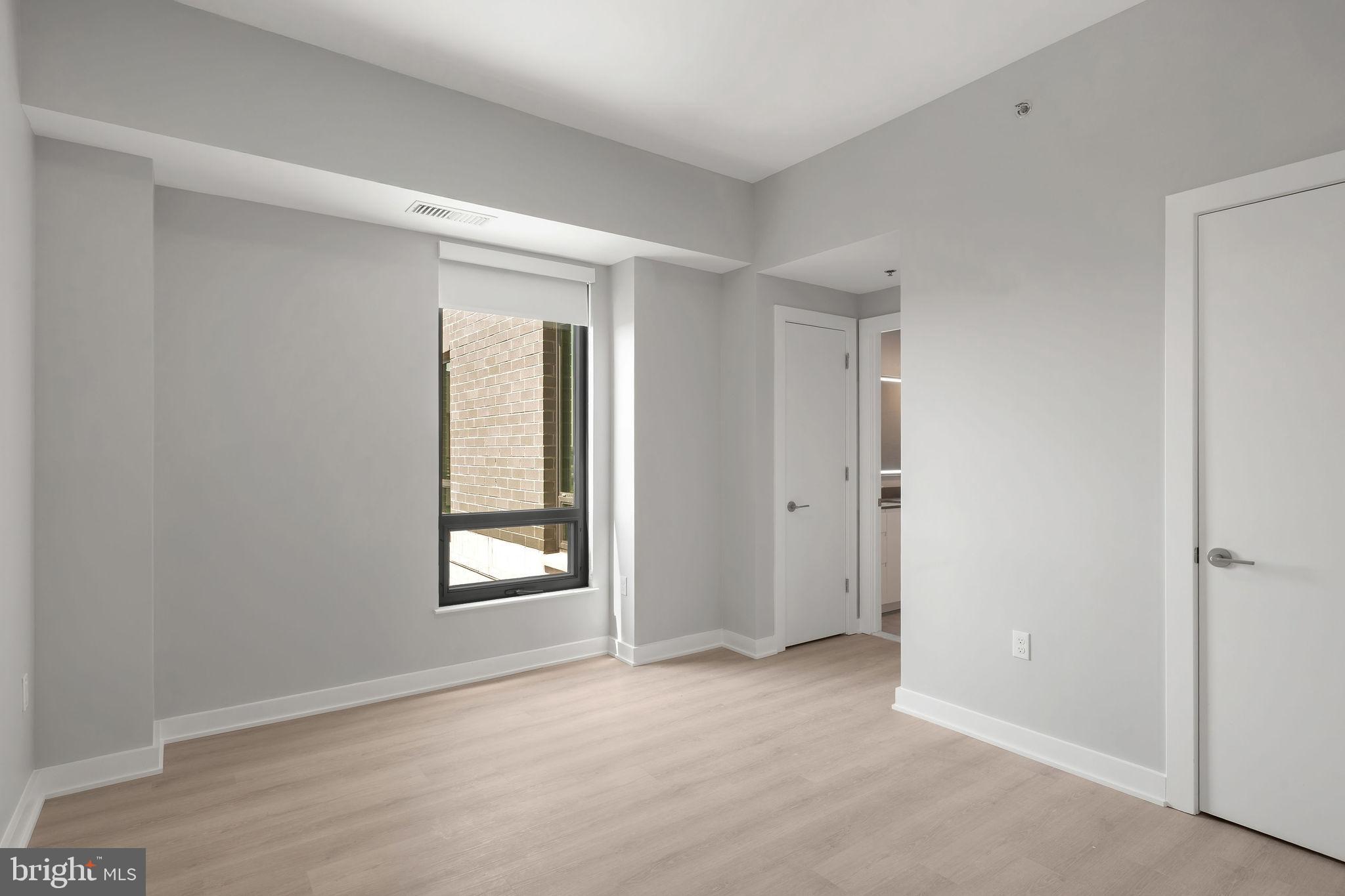 950 3rd Street Northwest, Unit PH1202 Washington, DC 20001 - Photo 36 of 45 a view of an empty room with a window and closet area