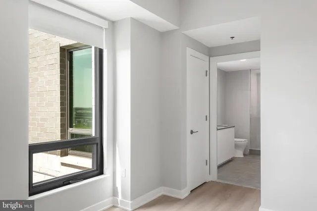 a bathroom with a double vanity sink mirror and toilet
