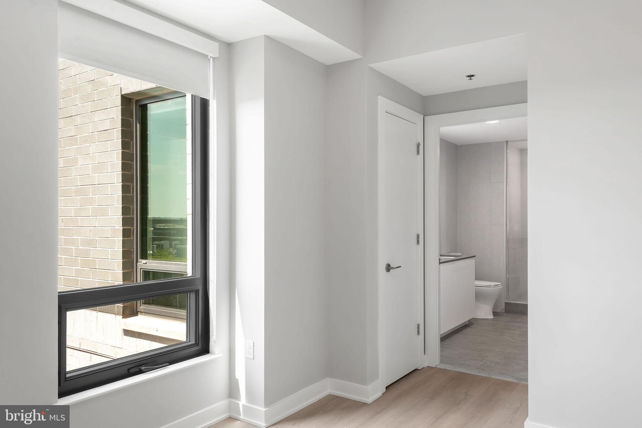 950 3rd Street Northwest, Unit PH1202 Washington, DC 20001 - Photo 37 of 45 a view of a bathroom with a toilet and a window