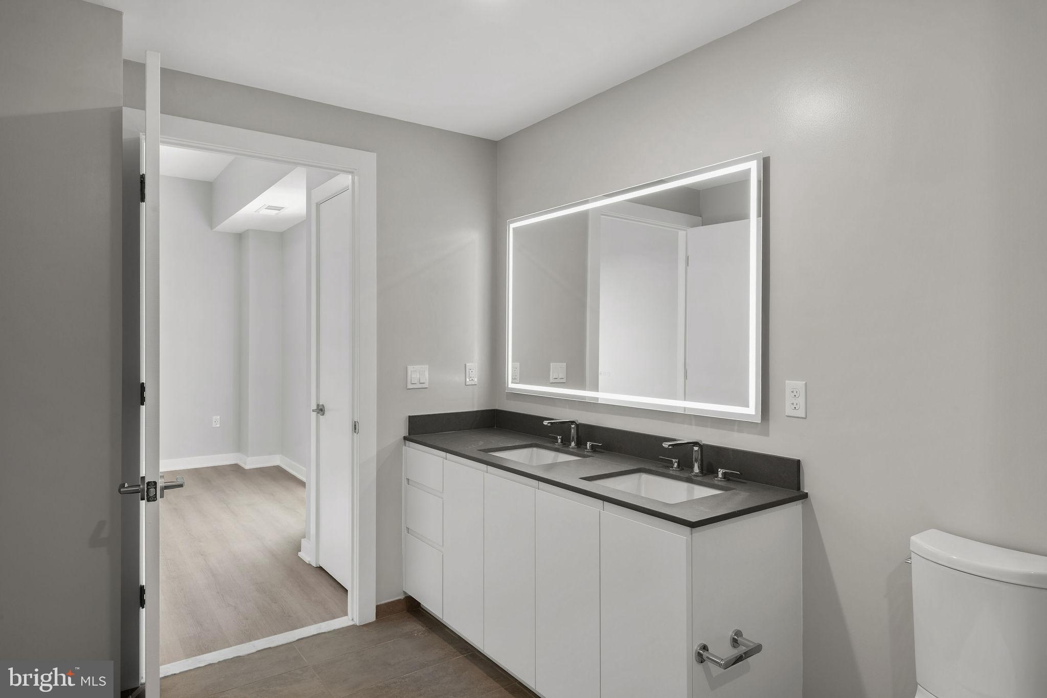 950 3rd Street Northwest, Unit PH1202 Washington, DC 20001 - Photo 40 of 45 a bathroom with a sink and a mirror