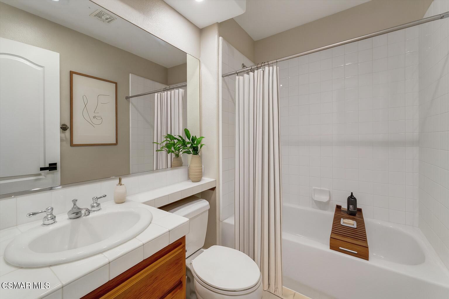 4101 Laurelview Drive Moorpark, CA 93021 - Photo 19 of 49 a bathroom with a sink toilet and shower