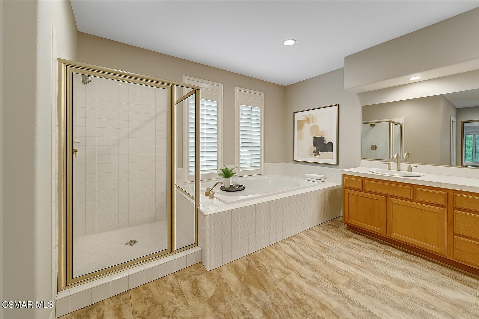 4101 Laurelview Drive Moorpark, CA 93021 - Photo 26 of 49 a large bathroom with a tub sink shower and mirror