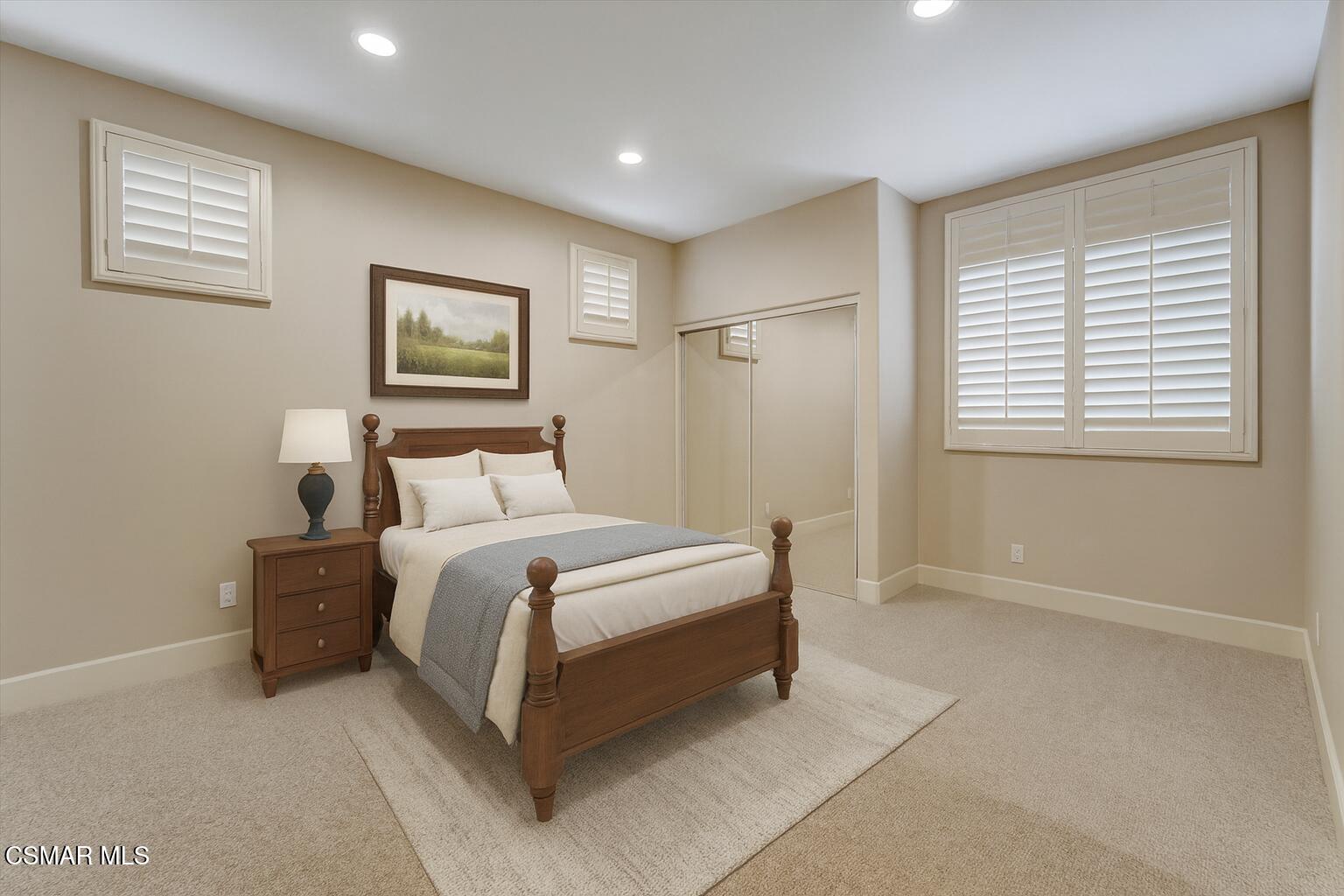 4101 Laurelview Drive Moorpark, CA 93021 - Photo 31 of 49 a spacious bedroom with a bed and a painting