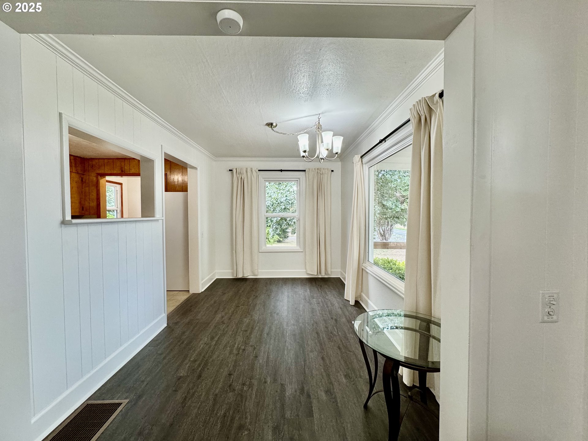 34603 Church Road Warren, OR 97053 - Photo 14 of 42 a view of hallway with a large window and wooden floor
