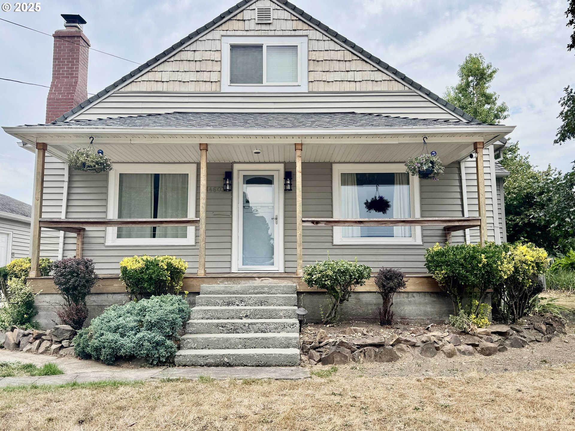 34603 Church Road Warren, OR 97053 - Photo 2 of 42 a front view of a house with potted plants