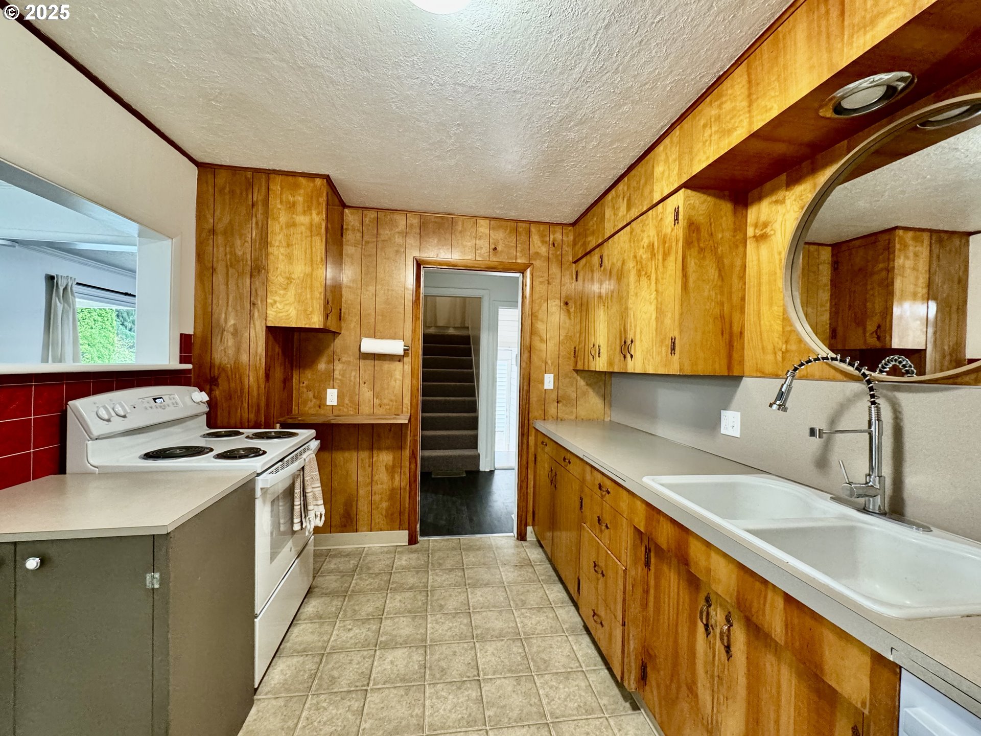 34603 Church Road Warren, OR 97053 - Photo 23 of 42 a kitchen with a sink and a stove top oven