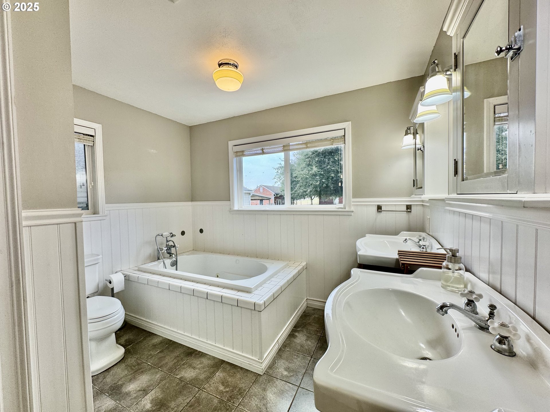 34603 Church Road Warren, OR 97053 - Photo 27 of 42 a bathroom with a double vanity sink mirror and toilet