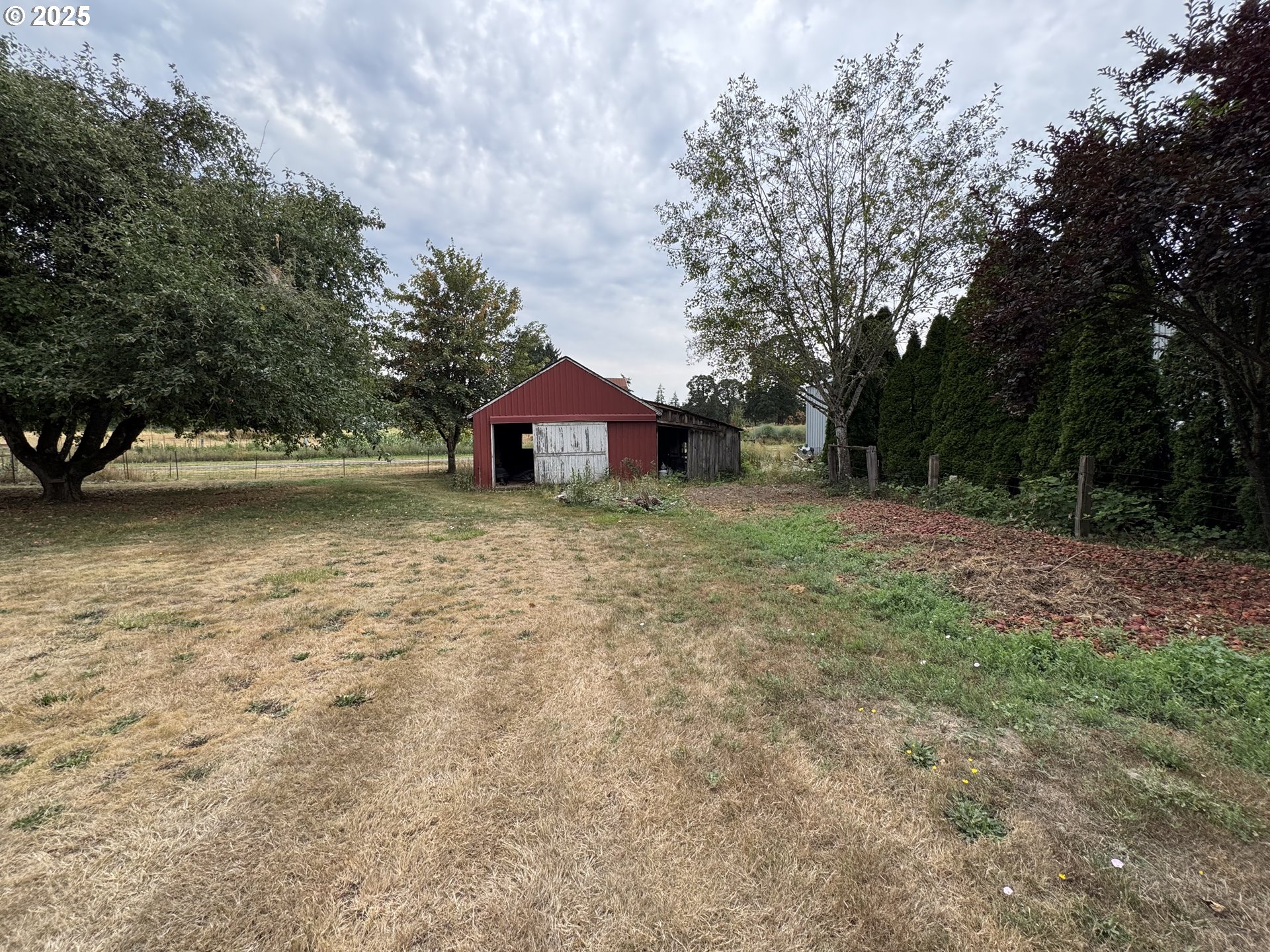 34603 Church Road Warren, OR 97053 - Photo 9 of 42 a view of a house with yard and sitting area