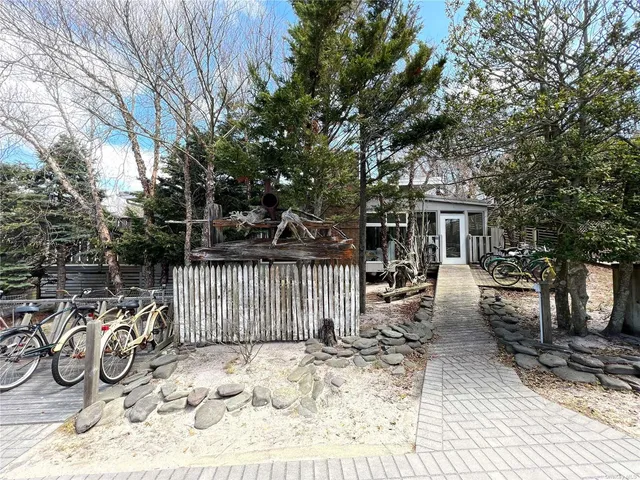 a view of a chair and tables in the patio