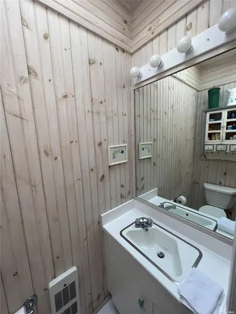 a bathroom with a sink and mirror