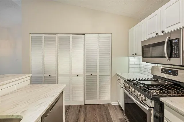 a bathroom with a bathtub and shower