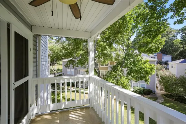 a view of a tall brick building next to a yard