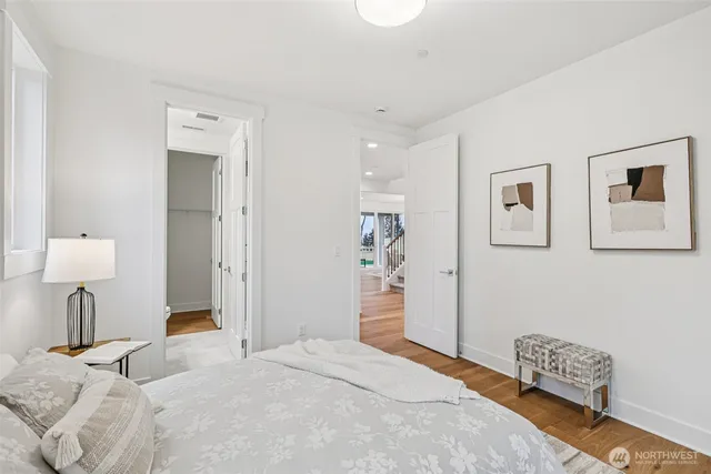 a bedroom with a bed and a lamp