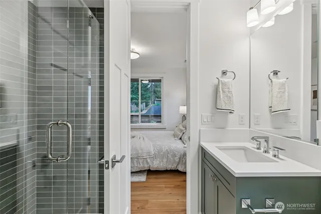 a en suite bathroom with a sink a toilet and shower