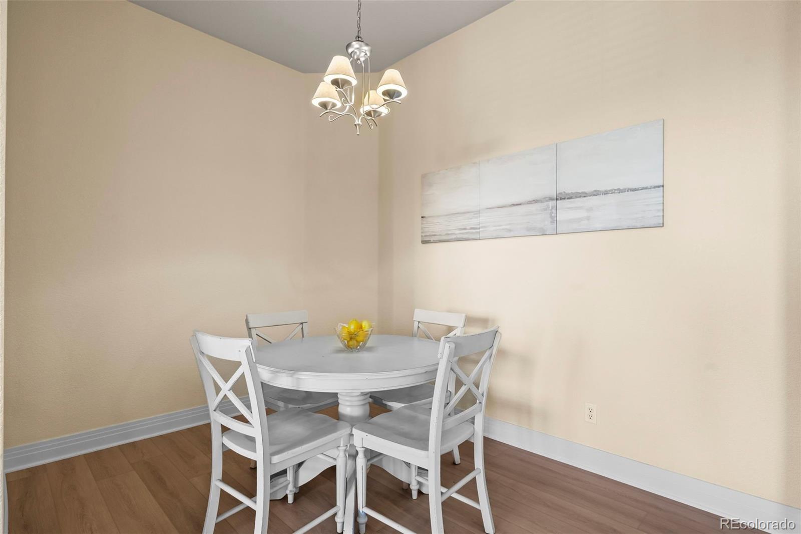 209 Quebec Street, Unit L Denver, CO 80220 - Photo 19 of 46 a view of a dining room with a table and chairs