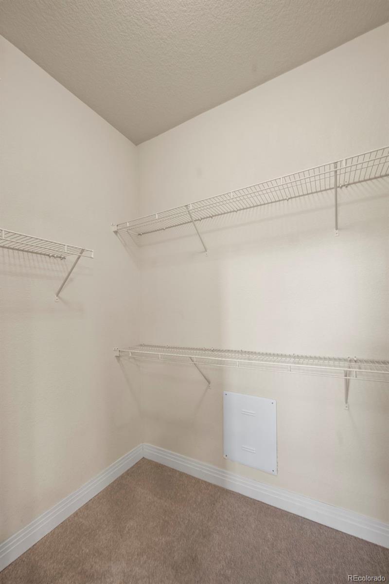 209 Quebec Street, Unit L Denver, CO 80220 - Photo 26 of 46 a view of a room with racks on the wall