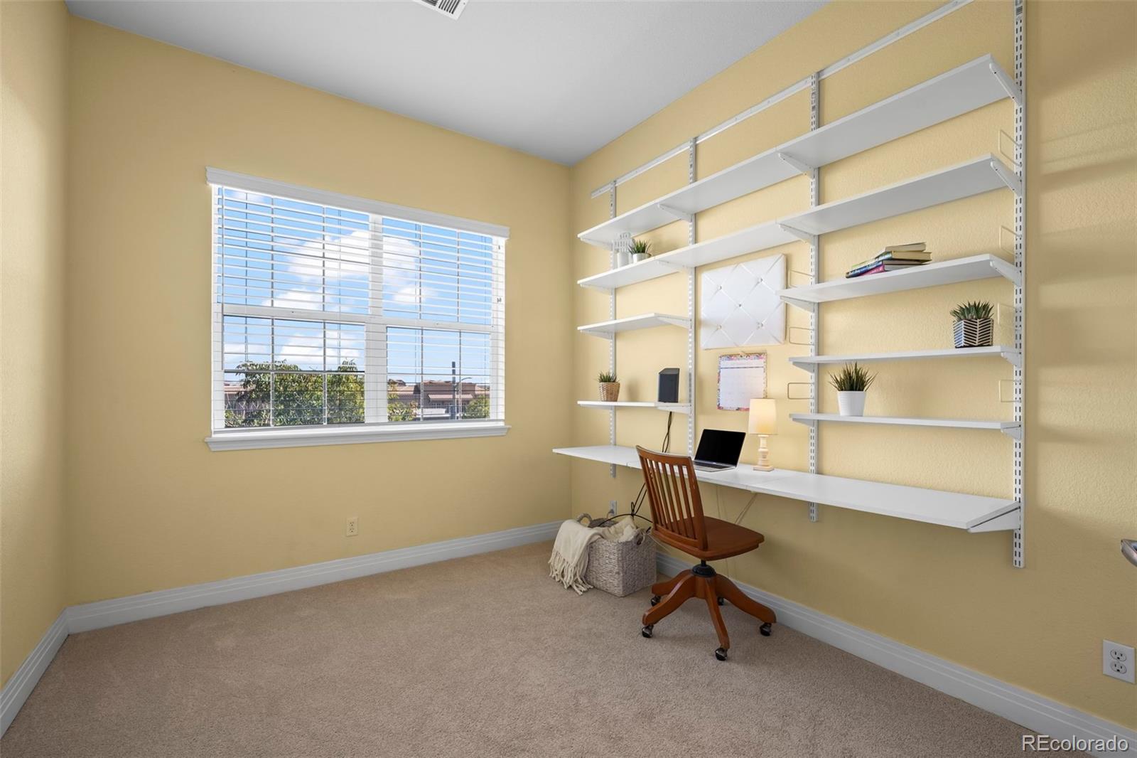 209 Quebec Street, Unit L Denver, CO 80220 - Photo 28 of 46 a living room with a window
