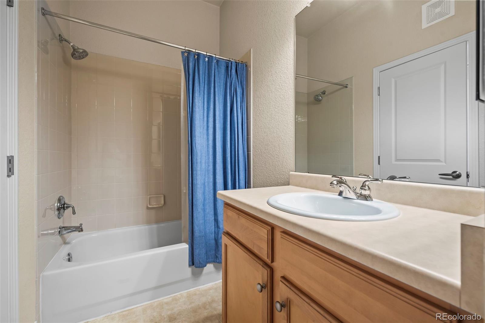 209 Quebec Street, Unit L Denver, CO 80220 - Photo 30 of 46 a bathroom with a sink and a bathtub