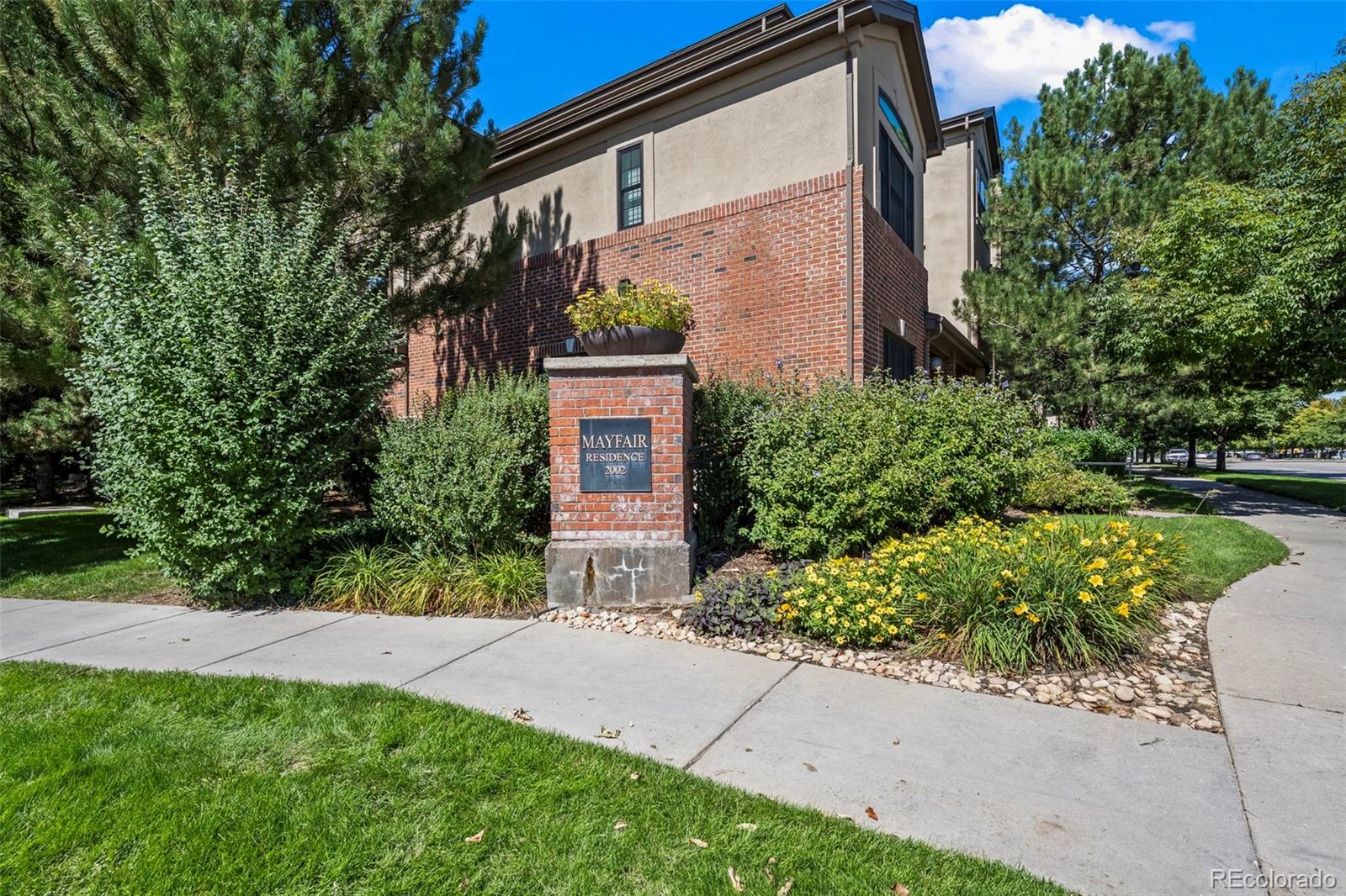 209 Quebec Street, Unit L Denver, CO 80220 - Photo 4 of 46 a view of a house with a yard