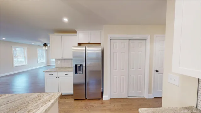 a kitchen with stainless steel appliances a stove sink and cabinets