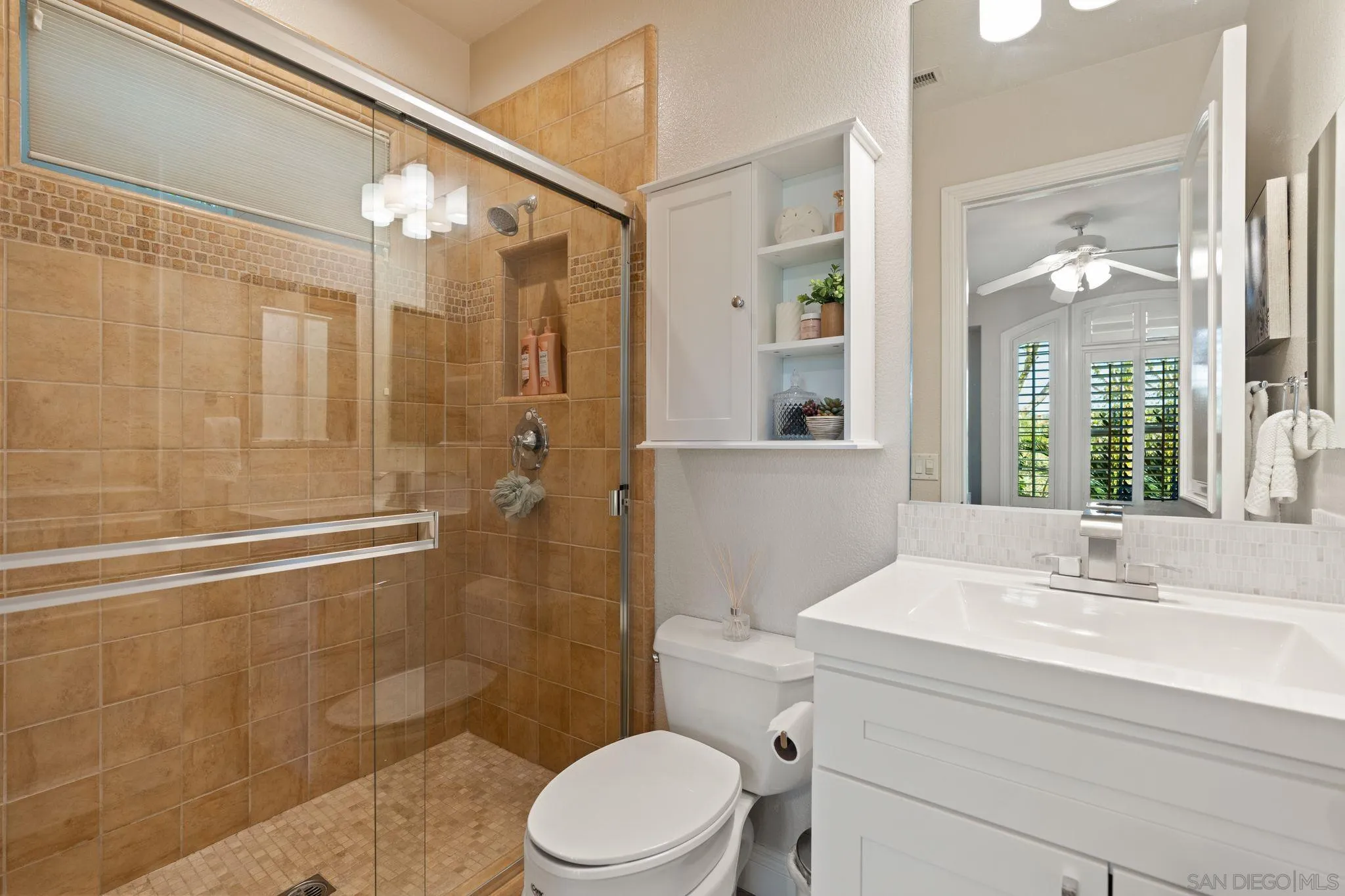 15583 Rising River Place South San Diego, CA 92127 - Photo 11 of 61 a bathroom with a sink a toilet and shower
