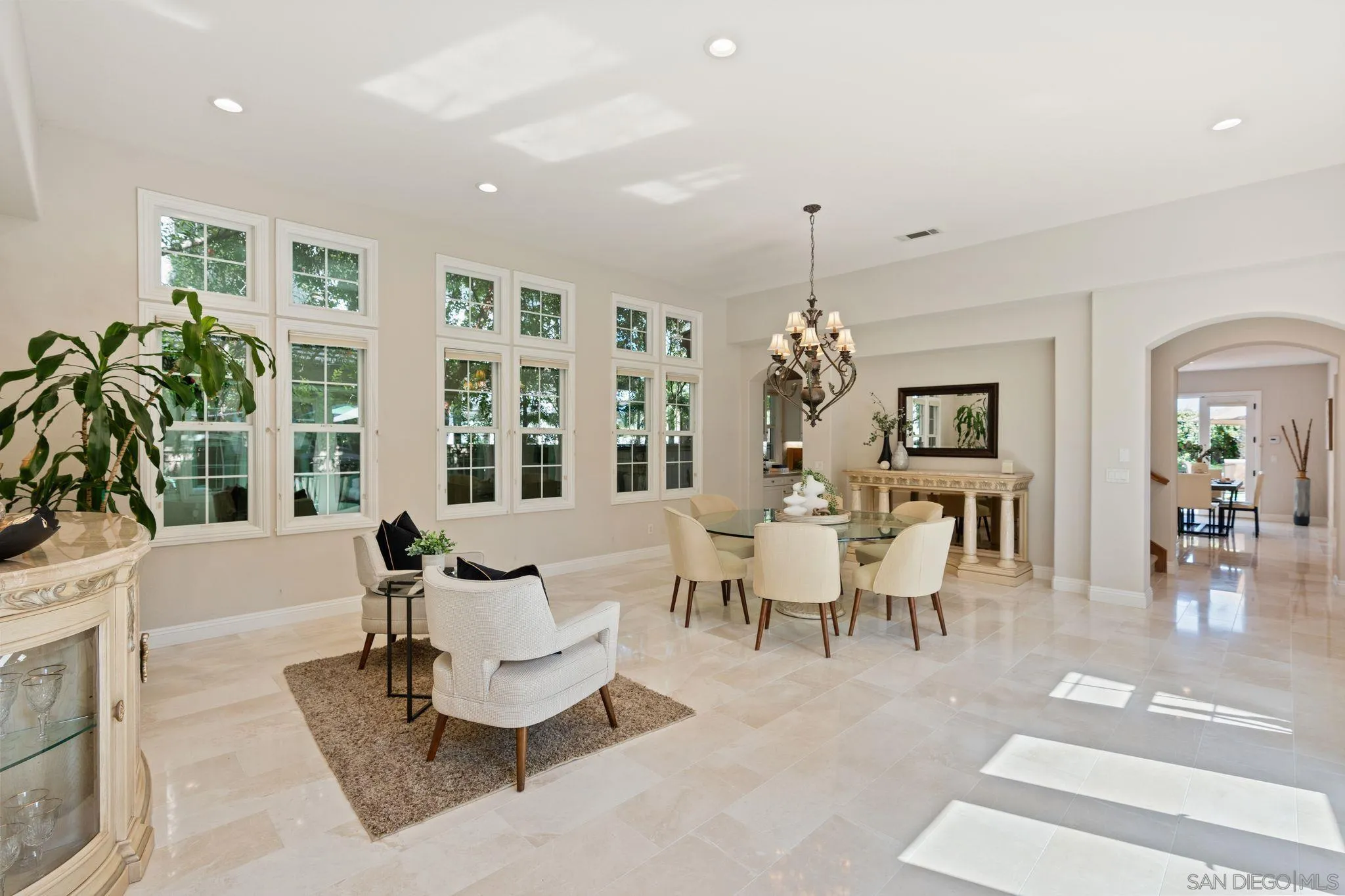 15583 Rising River Place South San Diego, CA 92127 - Photo 12 of 61 a living room with furniture and a chandelier