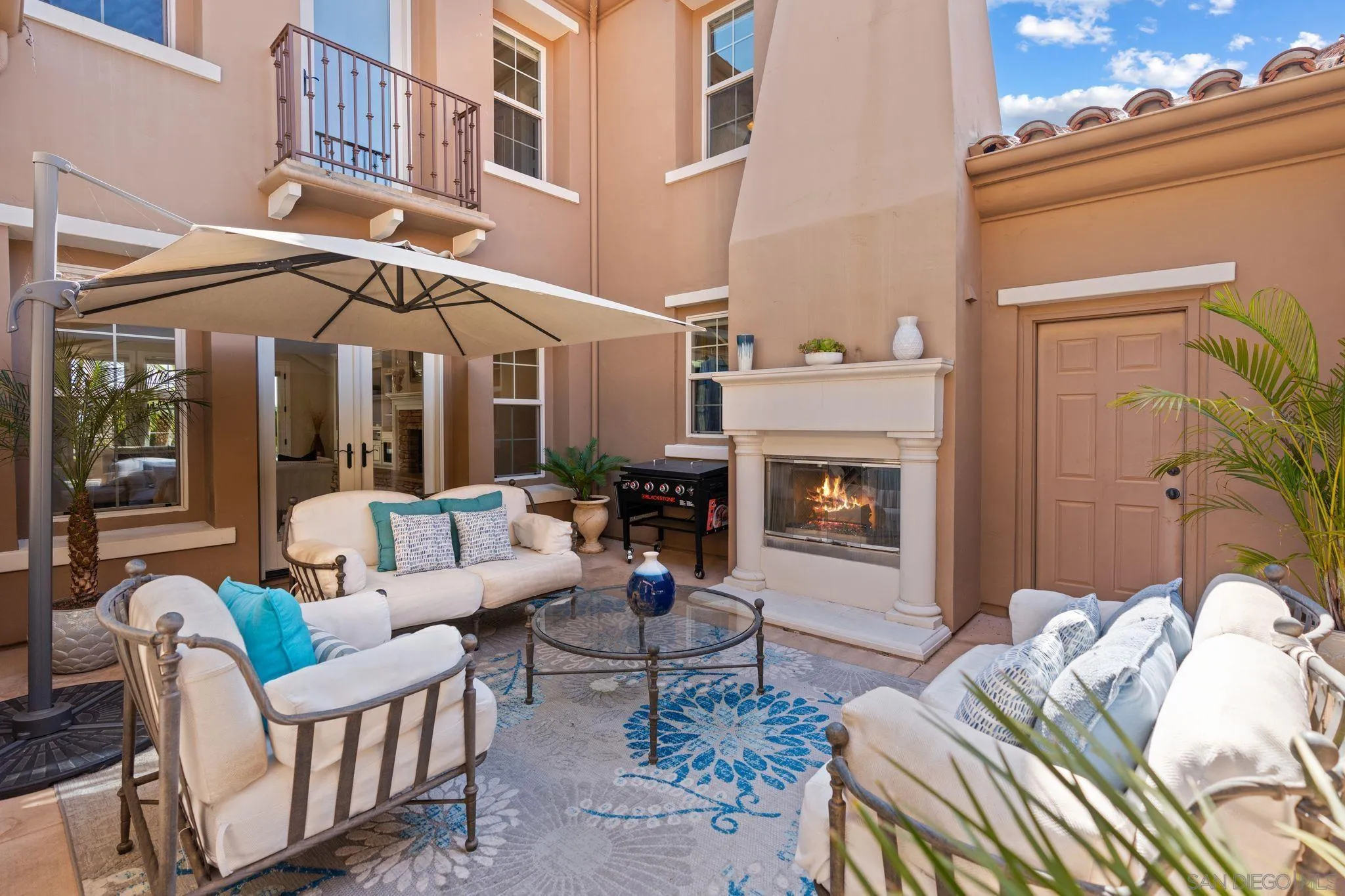 15583 Rising River Place South San Diego, CA 92127 - Photo 15 of 61 a living room with furniture fireplace and a fireplace