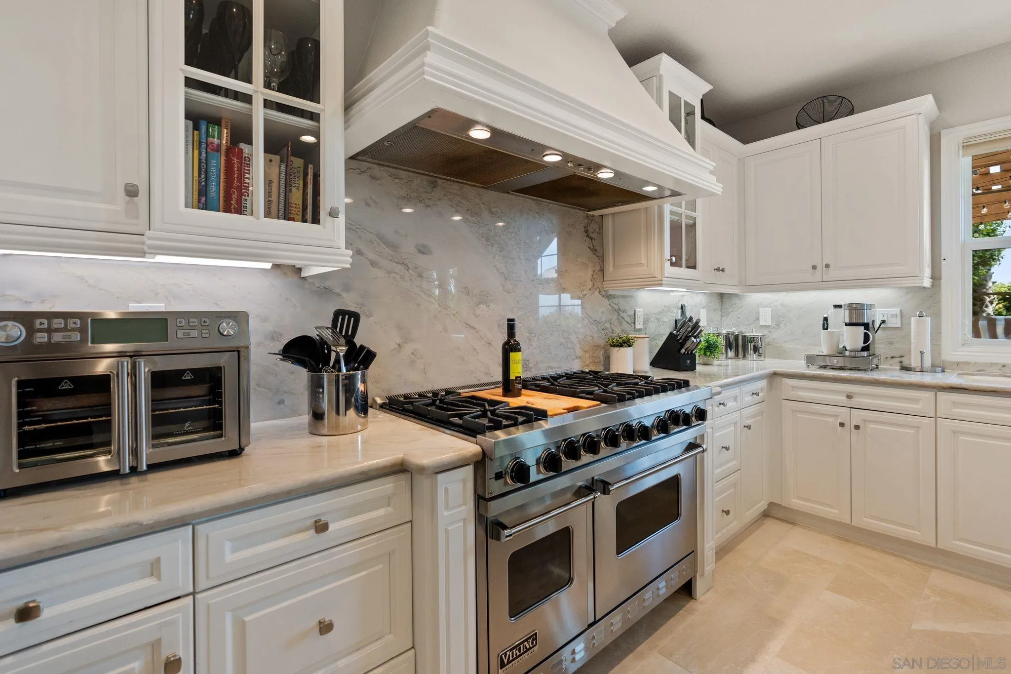 15583 Rising River Place South San Diego, CA 92127 - Photo 21 of 61 a kitchen with stainless steel appliances granite countertop a stove and a white cabinets