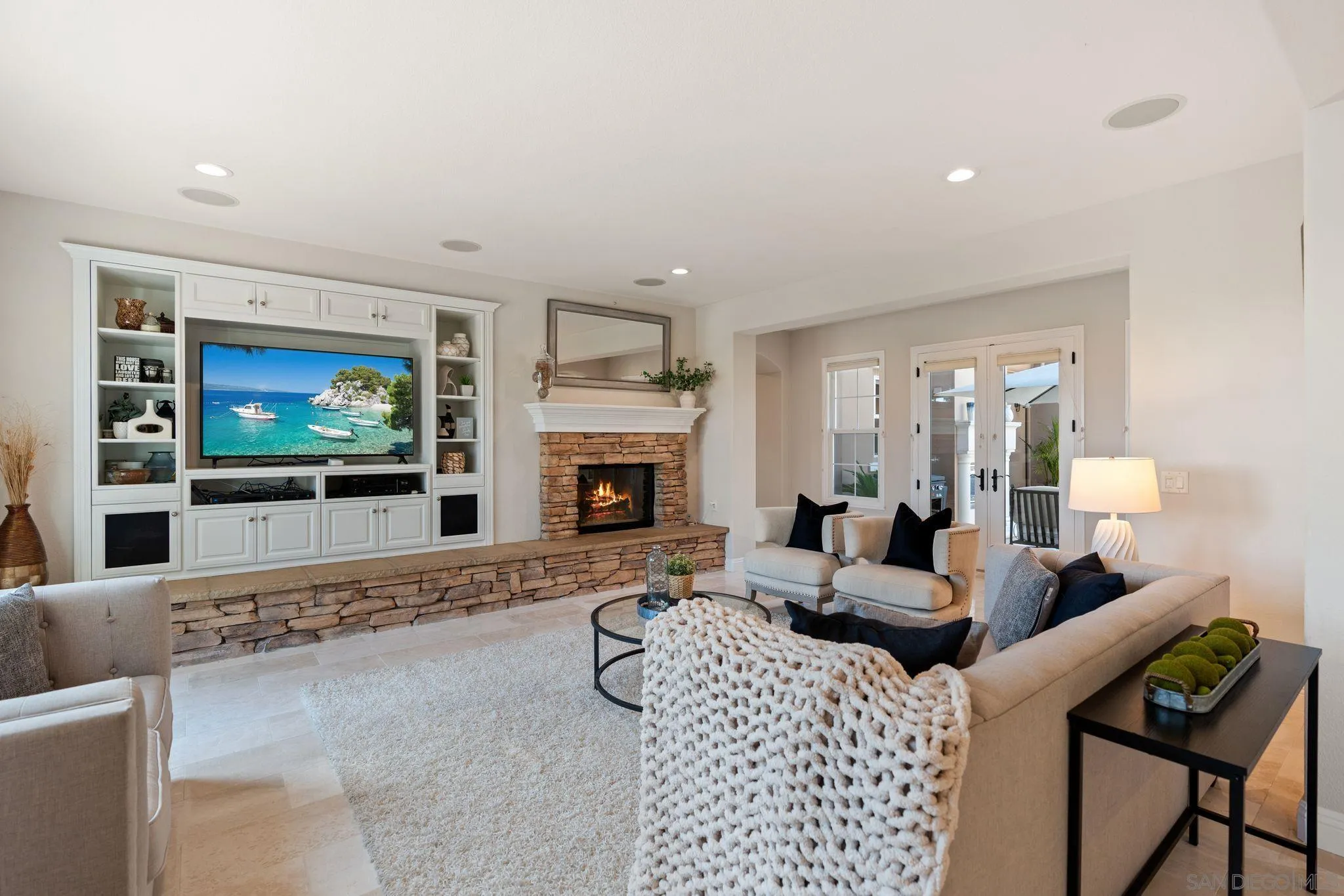 15583 Rising River Place South San Diego, CA 92127 - Photo 22 of 61 a living room with furniture a flat screen tv and a fireplace