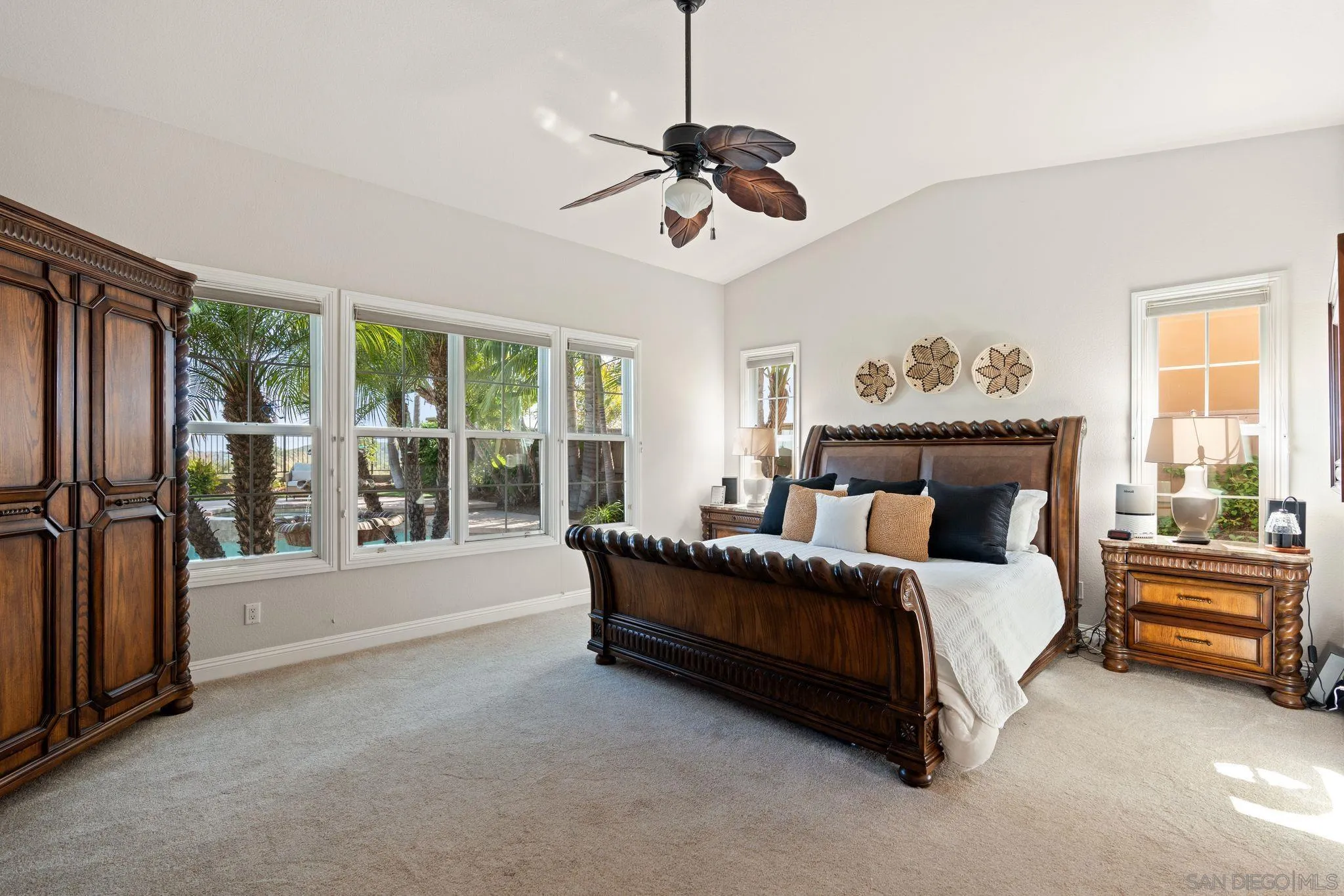 15583 Rising River Place South San Diego, CA 92127 - Photo 27 of 61 a spacious bedroom with a bed and a large window