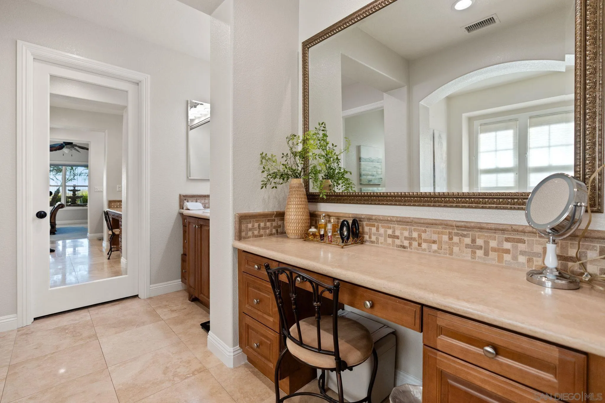 15583 Rising River Place South San Diego, CA 92127 - Photo 31 of 61 a bathroom with a sink and a mirror