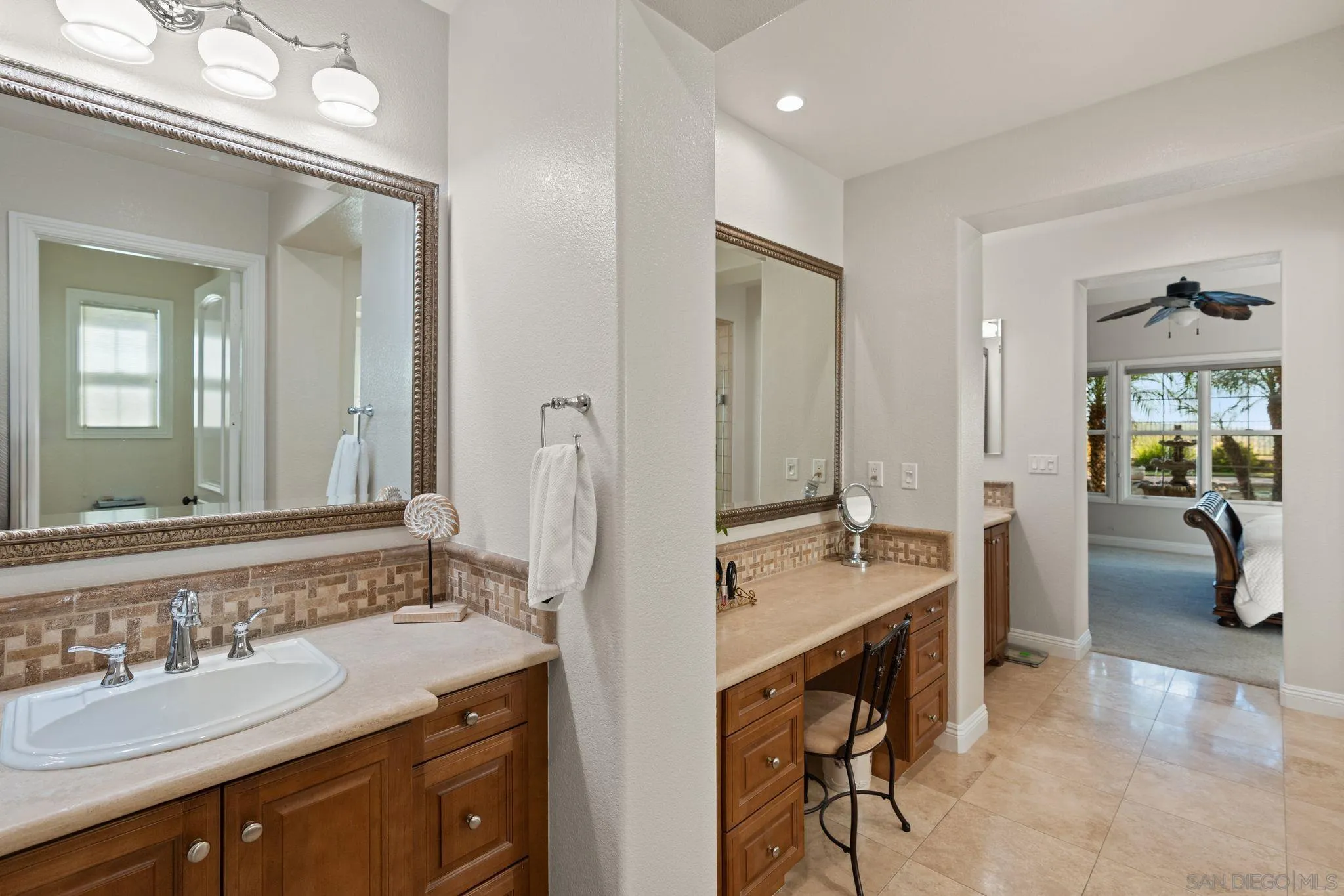 15583 Rising River Place South San Diego, CA 92127 - Photo 34 of 61 a spacious bathroom with a sink double vanity and a mirror