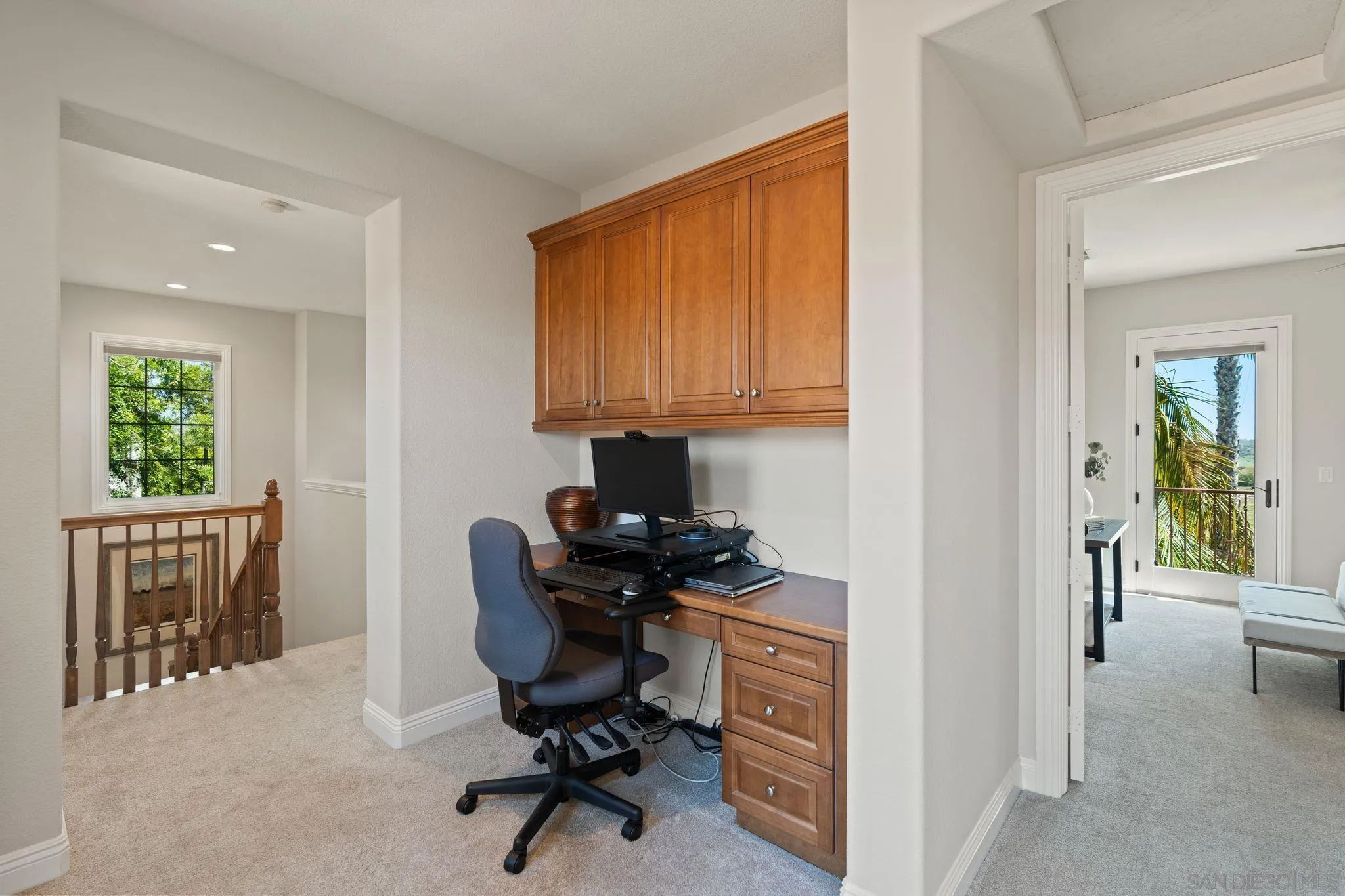 15583 Rising River Place South San Diego, CA 92127 - Photo 44 of 61 a view of a workspace with furniture and a window