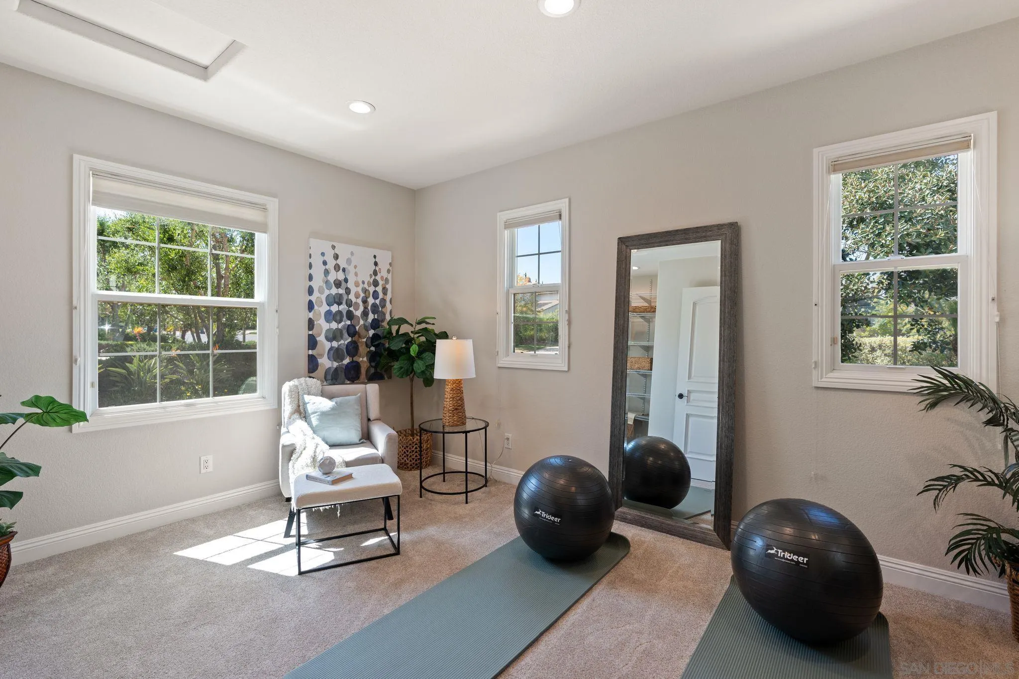 15583 Rising River Place South San Diego, CA 92127 - Photo 6 of 61 a living room with furniture a window and potted plant
