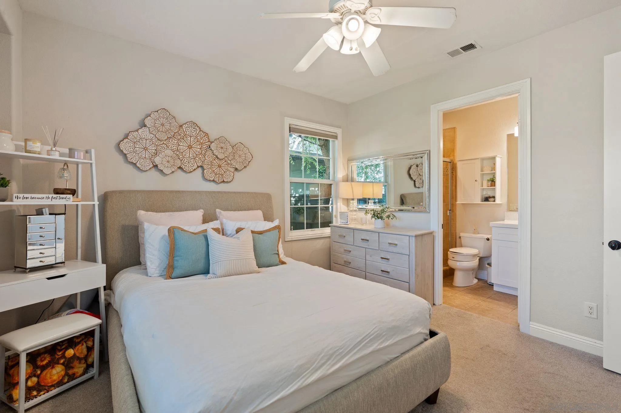 15583 Rising River Place South San Diego, CA 92127 - Photo 10 of 61 a spacious bedroom with a bed and a chandelier