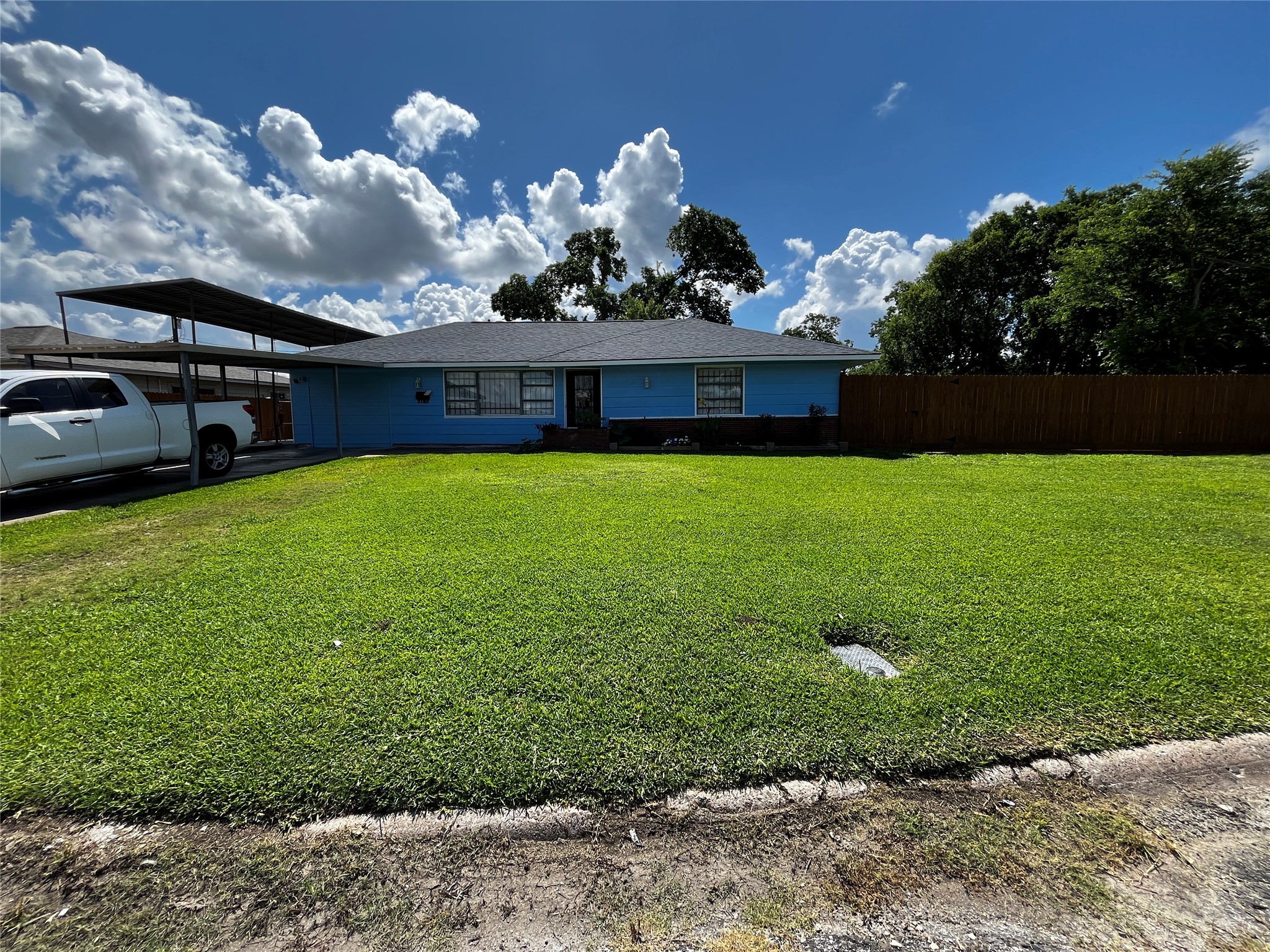3163 Roe Drive Houston, TX 77087 - Photo 2 of 47 a front view of a house with garden