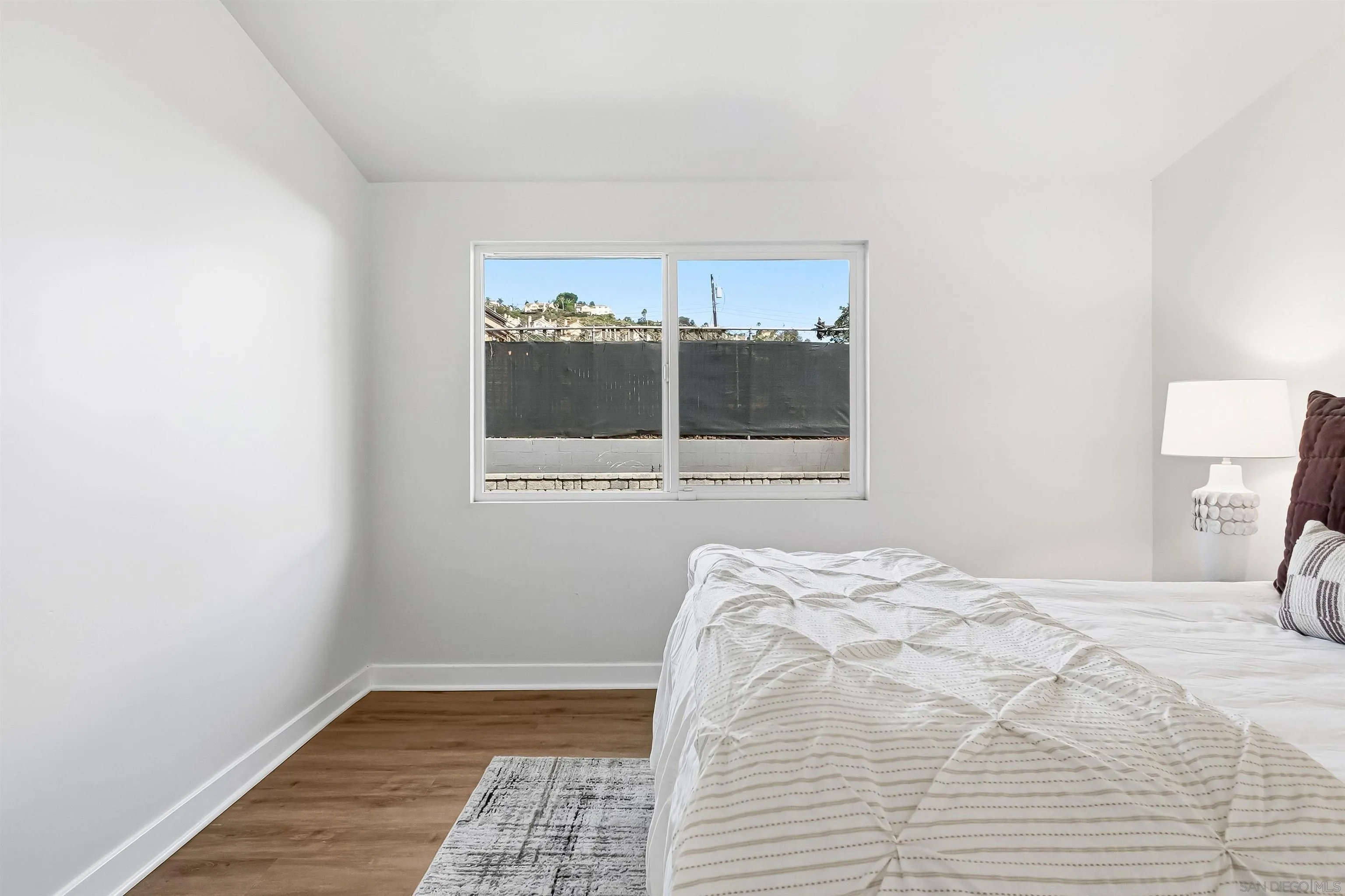 9844 Arapaho Street Spring Valley, CA 91977 - Photo 17 of 29 a bedroom with a bed and a window