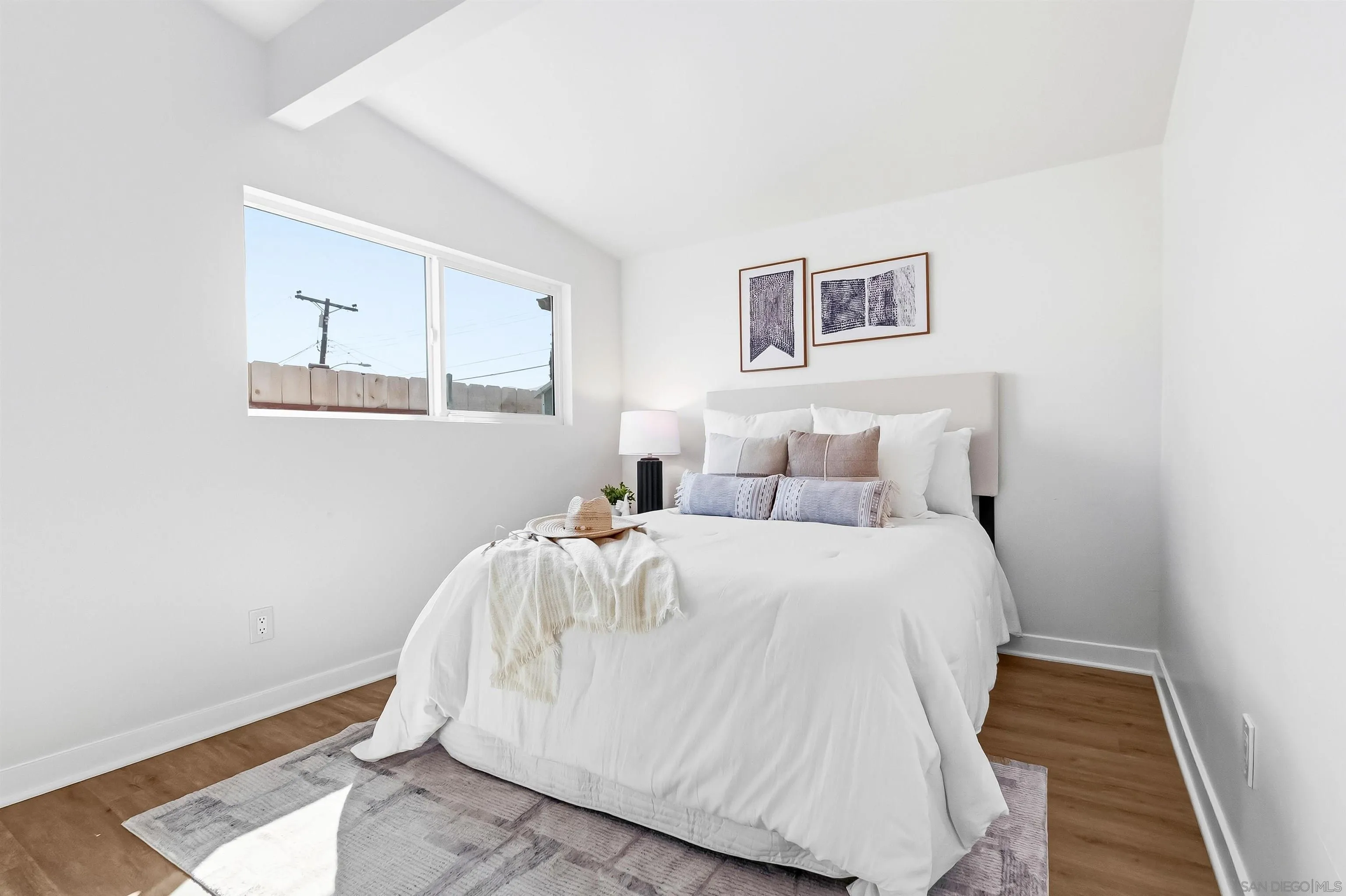 9844 Arapaho Street Spring Valley, CA 91977 - Photo 18 of 29 a bed room with a bed and a painting on the wall