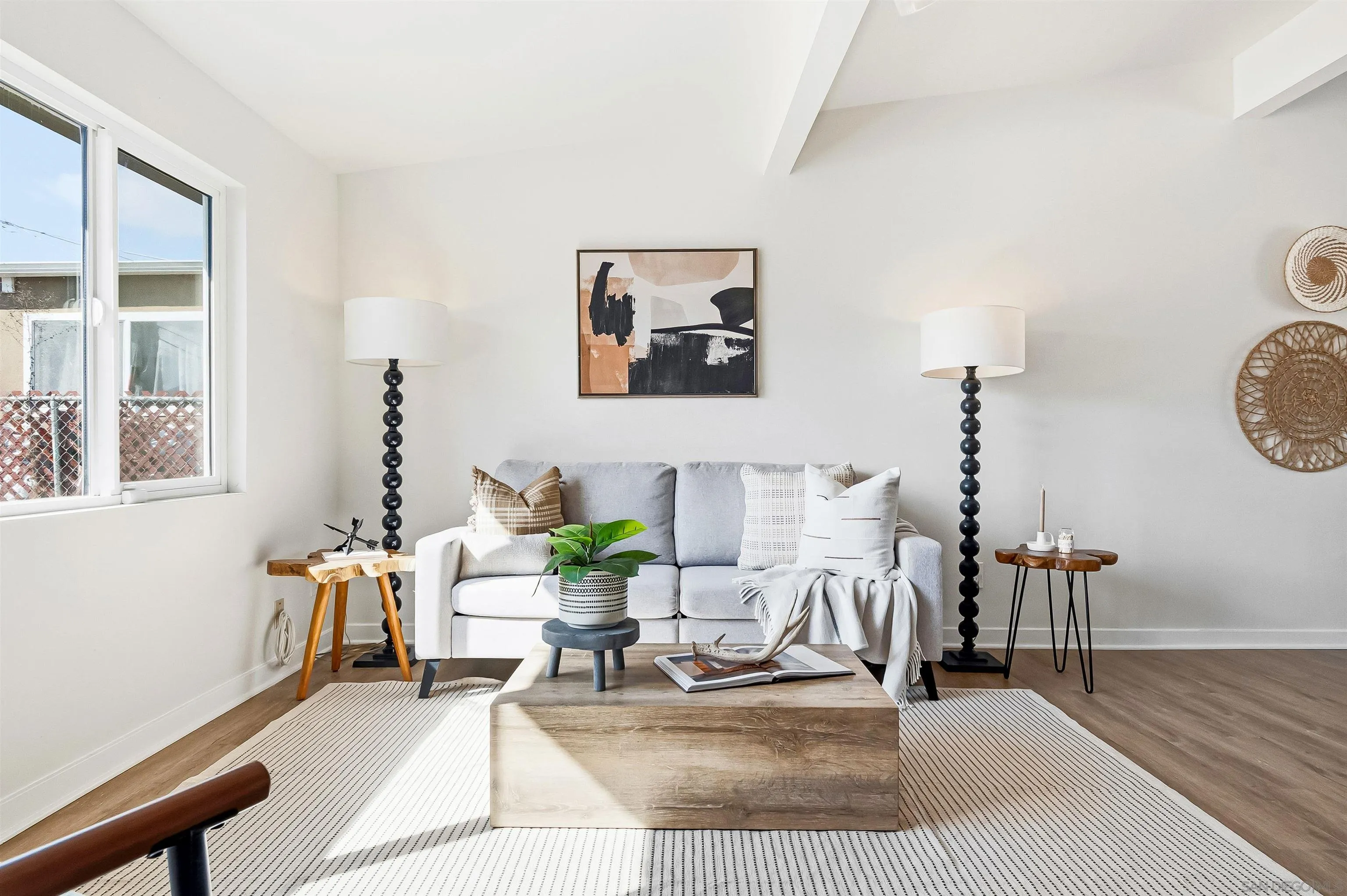 9844 Arapaho Street Spring Valley, CA 91977 - Photo 2 of 29 a living room with furniture and wooden floor